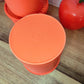 Boite TUPPERWARE soleil orange vintage. Boite TUPPERWARE soleil orange des années 80.   Avec son couvercle plissé comme un soleil, vous n'aurez qu'à appuyer au milieu pour la fermer.  En très bon état, made in France. 